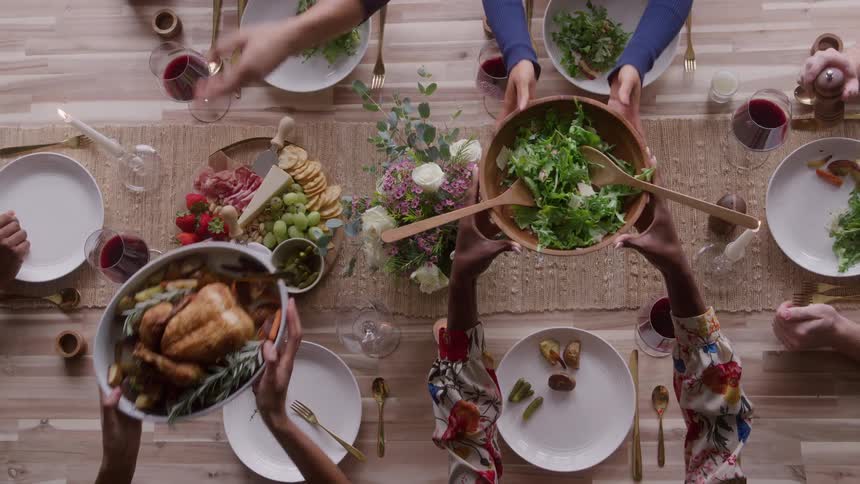 Food is being served to people at the table