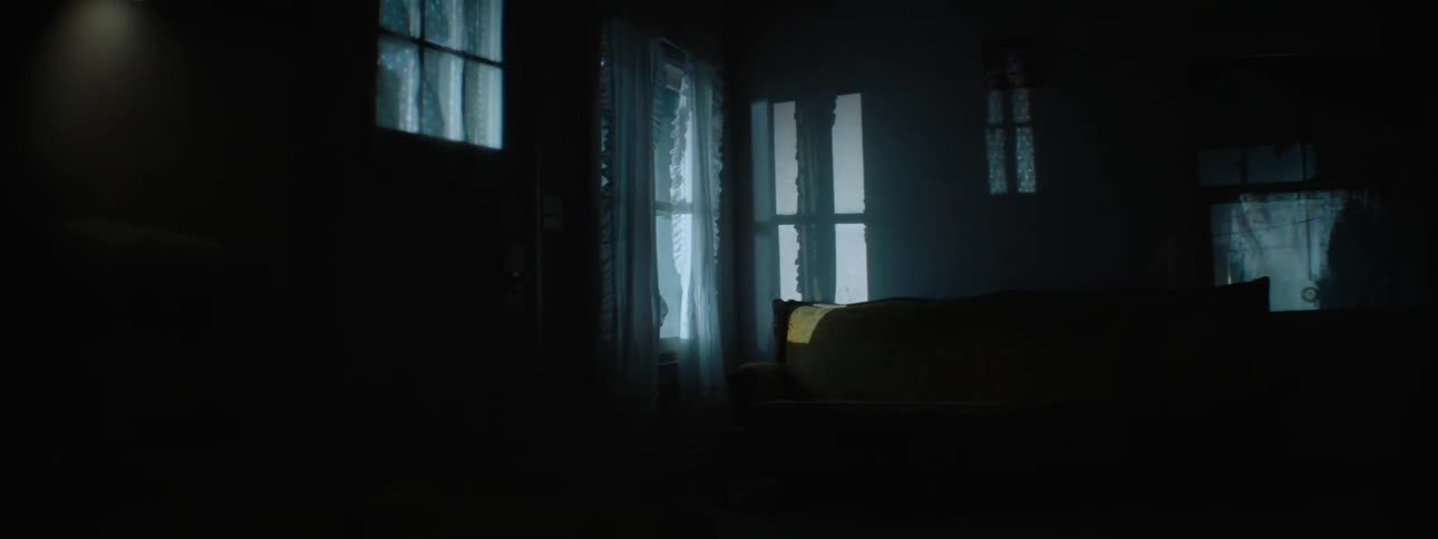 Lights shine in through a living room window