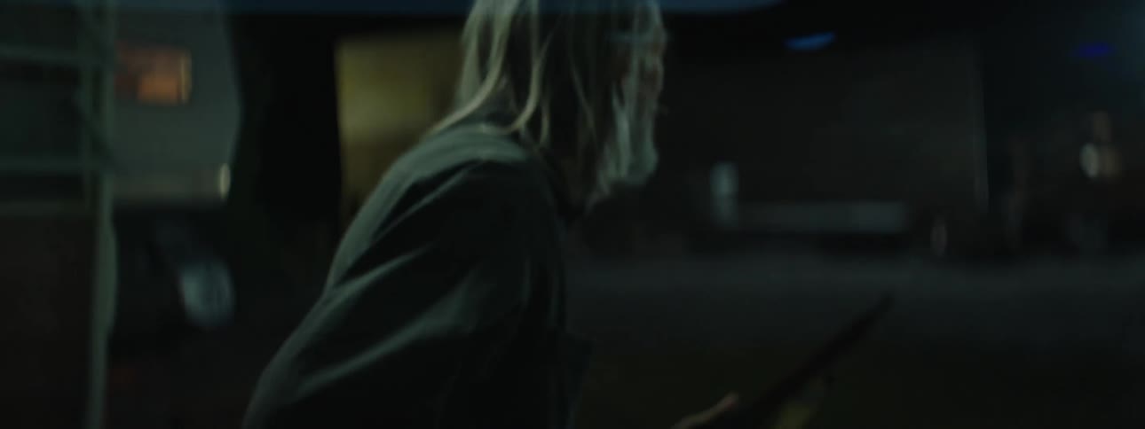 A man looks around out of his home before exiting