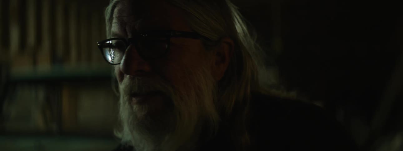 A man looks around with lights blinking all around