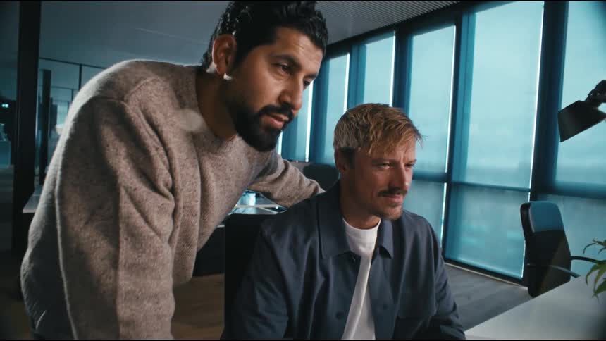 colleagues working together on a desk