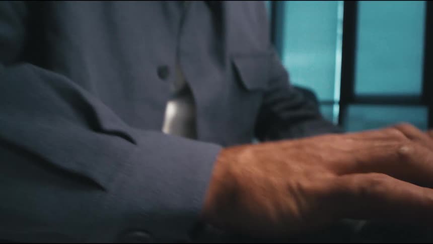 macro camera move of man thinking, then starting to type motivated on the keyboard