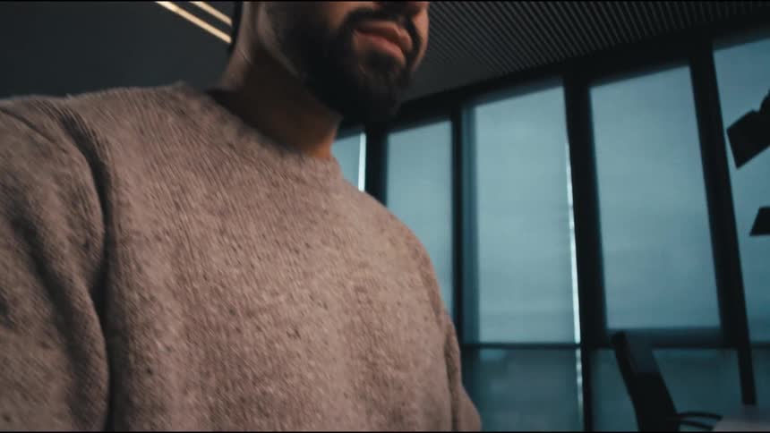 special camera move of a man being concentrated at his computer then pressing enter