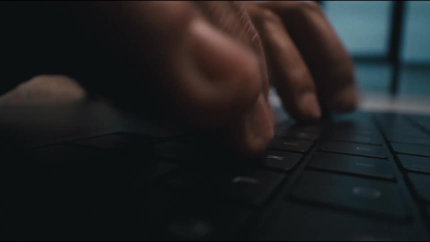 Man typing on the keyboard with focus and speed