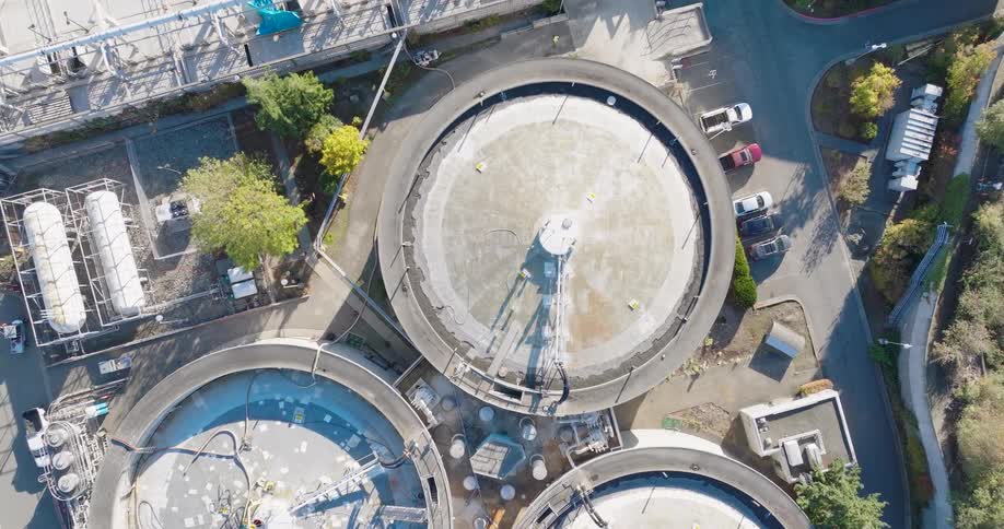 Wastewater is treated in large digester tanks and other equipment at a sewage treatment plant