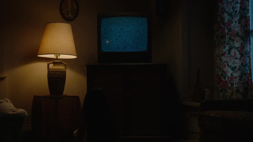 Static on a tv in a dim room