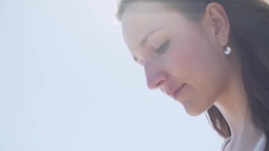 Sun shining down on a woman