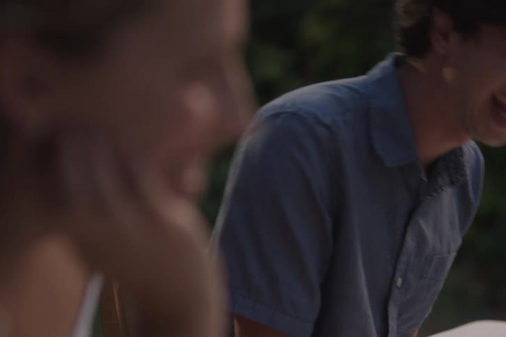 Couple laughing together outdoors
