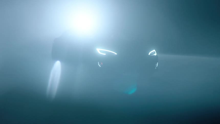 Car driving on pavement at night