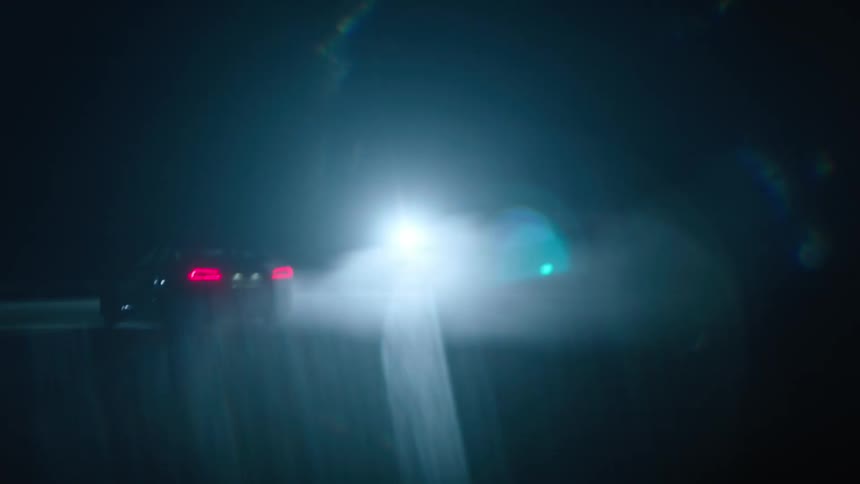 Car lights reflect and shine at night