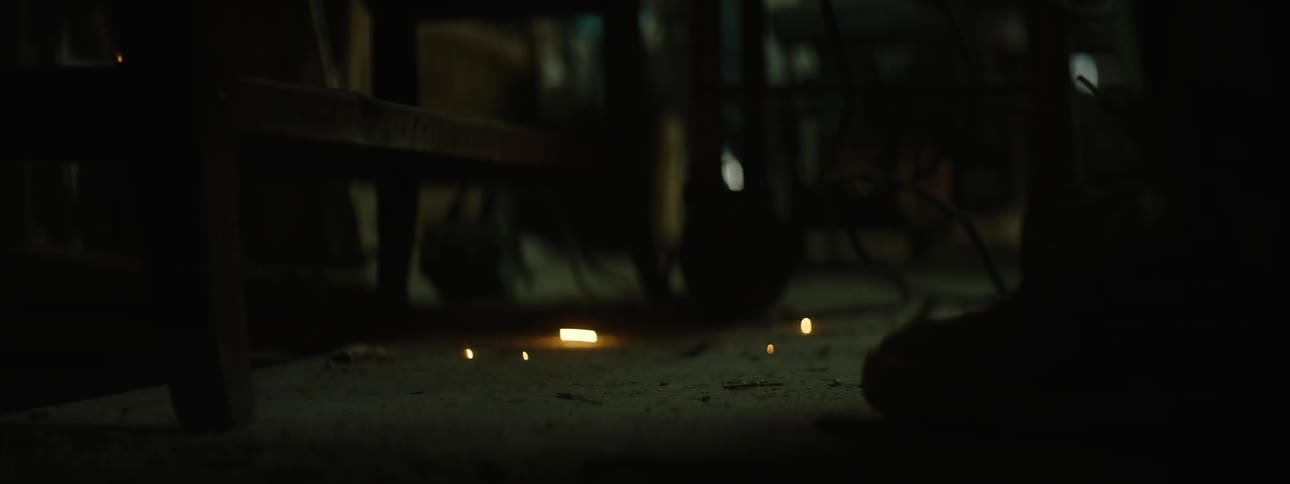 Embers and sparks fall onto the workshop floor