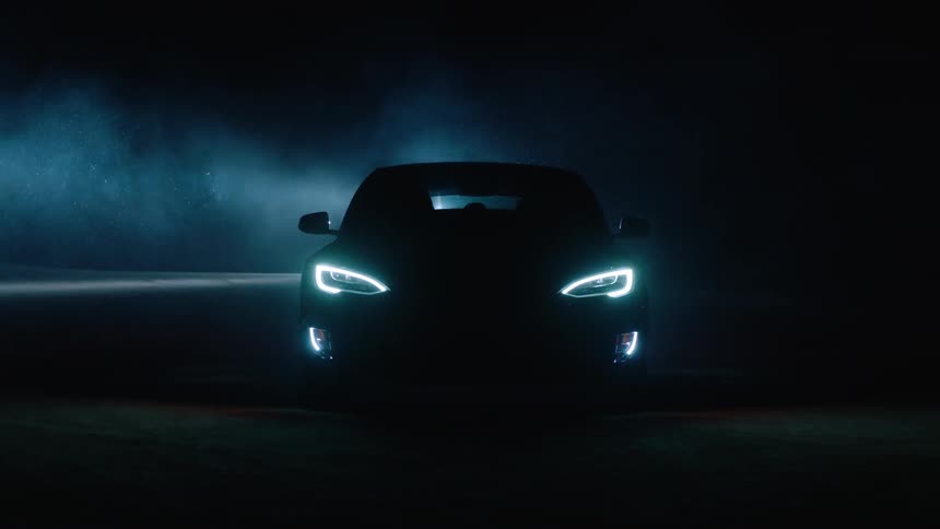 A car starts up in a dark area