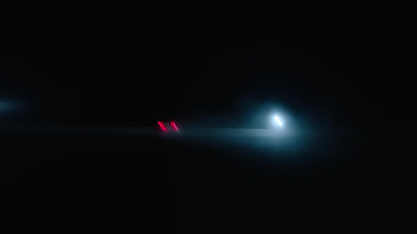 A car drives near bright lights at night