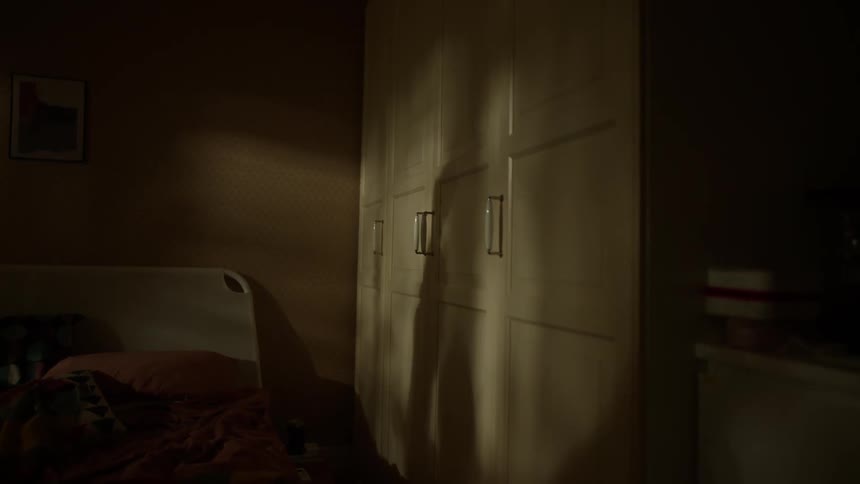 The person is casting a shadow on the wall
