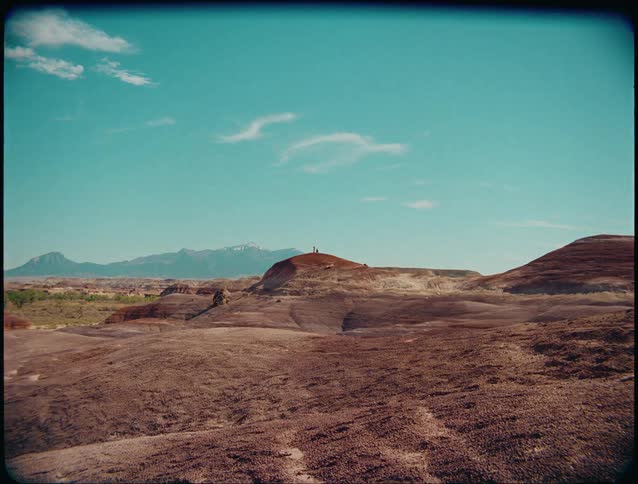 Two people on top of a hill