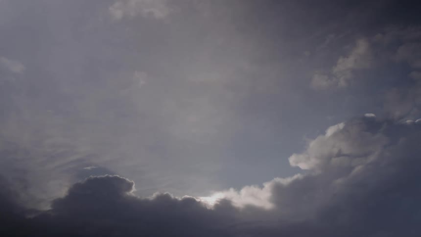Sunlight tints the clouds
