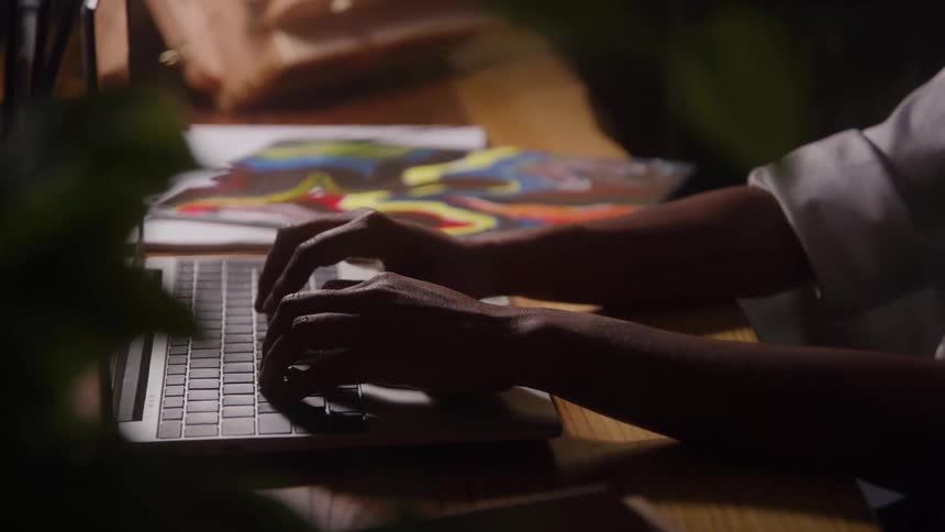 A person types on a keyboard