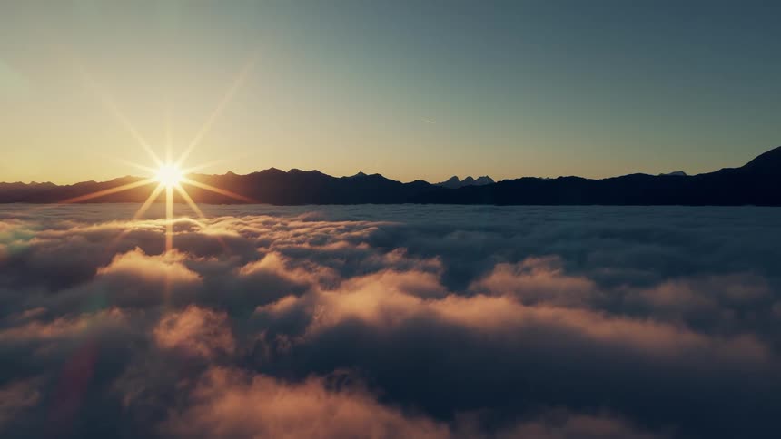The sun touches the mountains