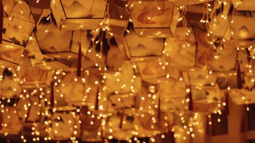 Paper lanterns sway in the breeze