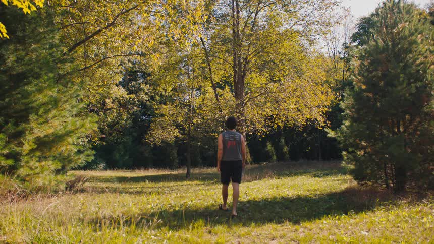 A man walks in a park