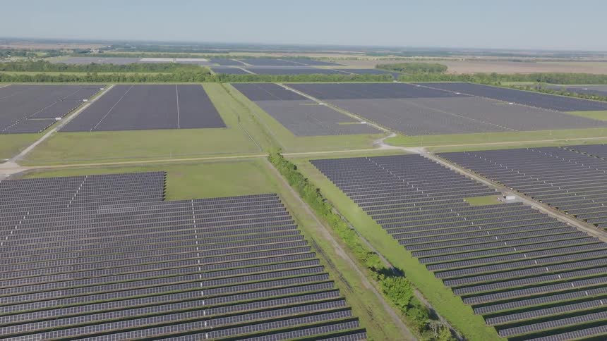 Vast field of solar panels installed in a rural area