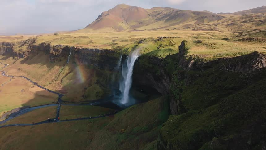 Water cascades down a cliff