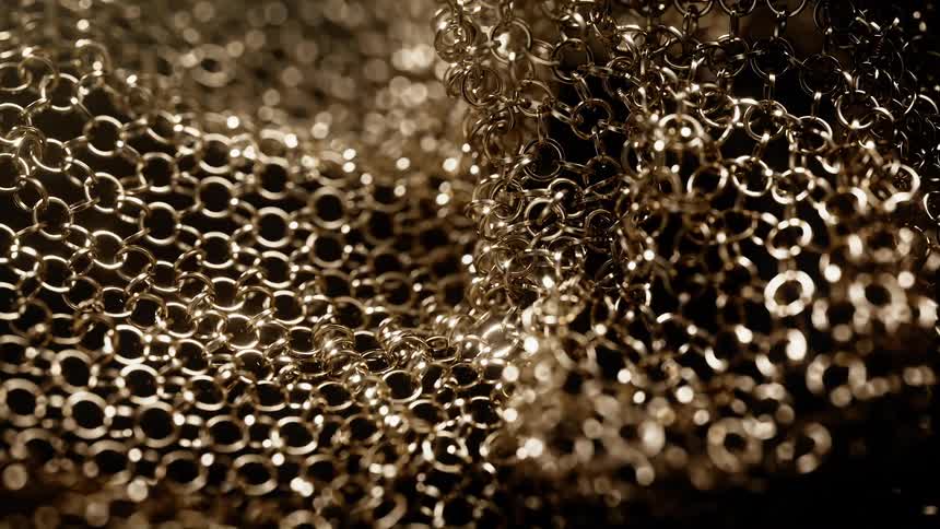 A series of golden rings connected together in a dark atmosphere