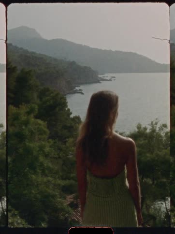 A lady looks out towards the coast