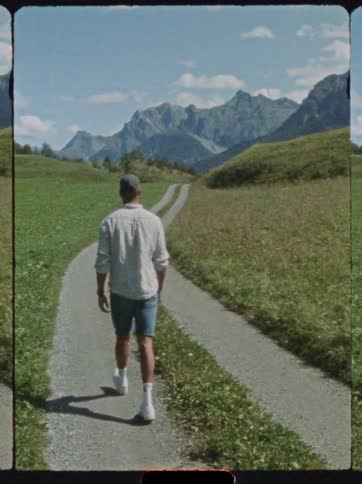 A man walks down a road