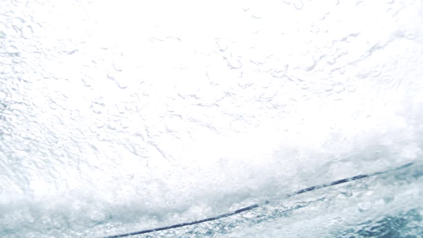 Surfboard gliding beneath the ocean surface