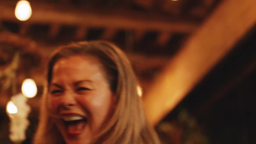 Cheerful blonde woman dancing