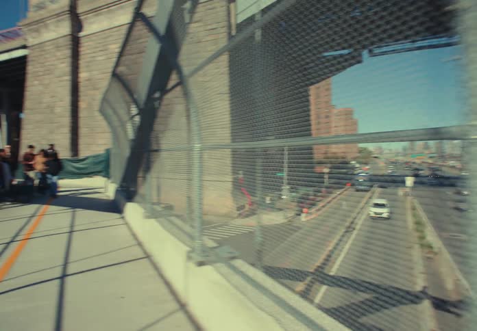 Friends walk on the overpass that runs over the freeway