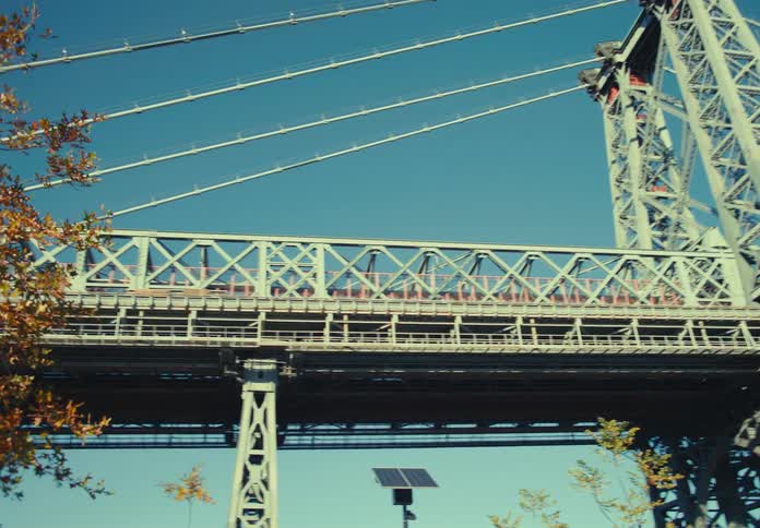 Metal structure of a suspension bridge on a sunny day