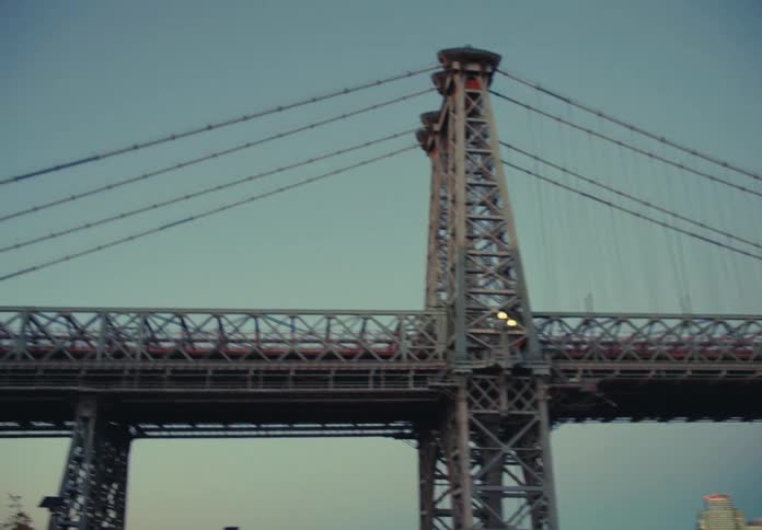 A large bridge spans a wide river