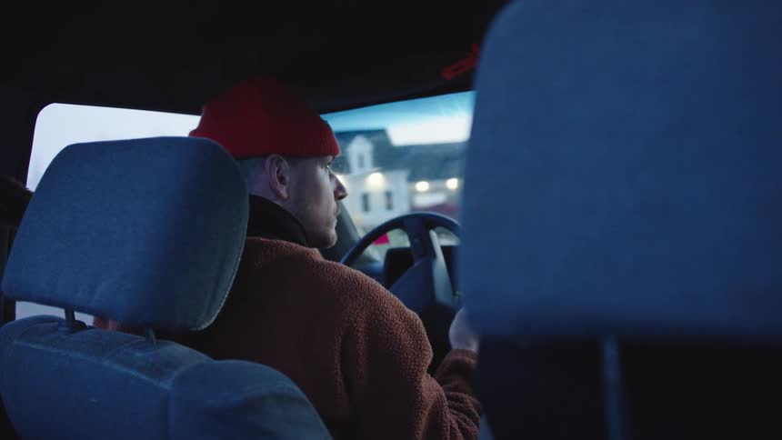 The man is steering the vehicle
