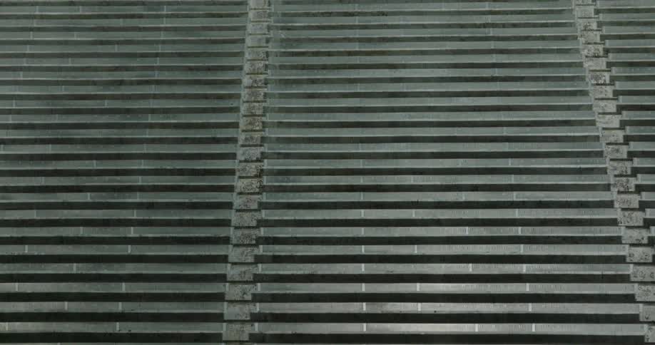 Aligned metal bleachers seen from the front in an empty structure