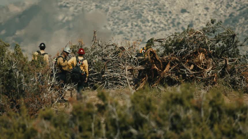 First responders on location in the mountains during a controlled brush fire