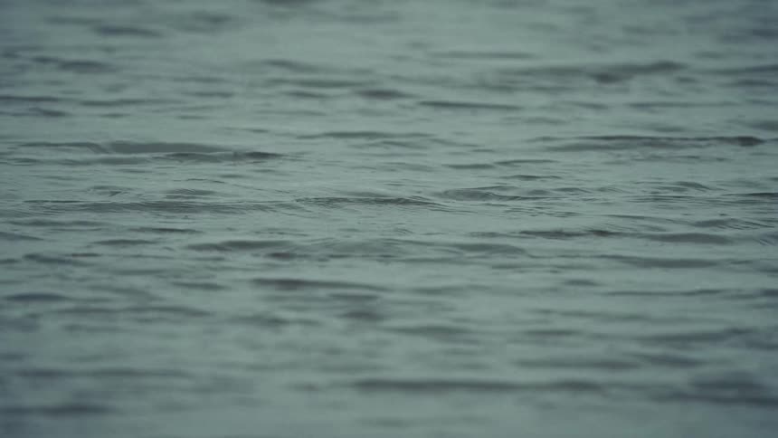 Light shines on the water as it ripples and waves