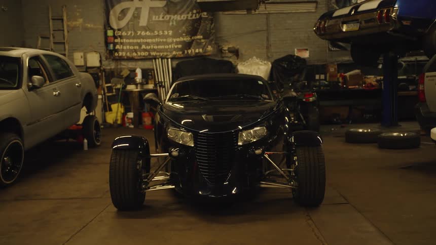 A hotrod car in a garage