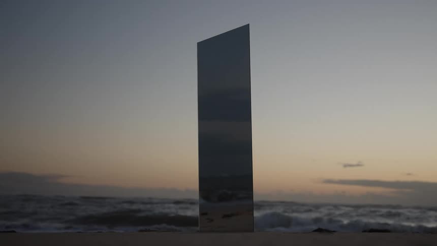 There is a see through tower on the beach
