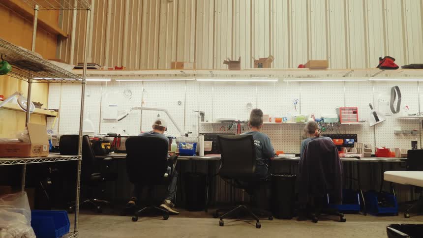 People are sitting at the table working and talking