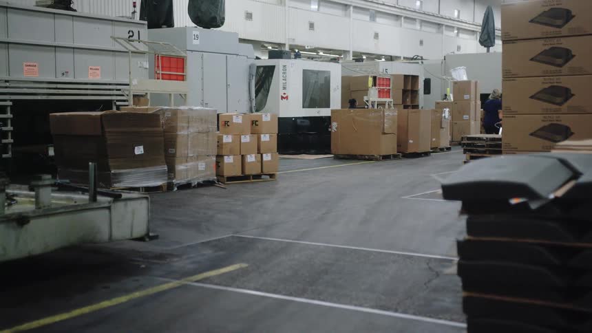 The boxes are stacked on pallets in the warehouse
