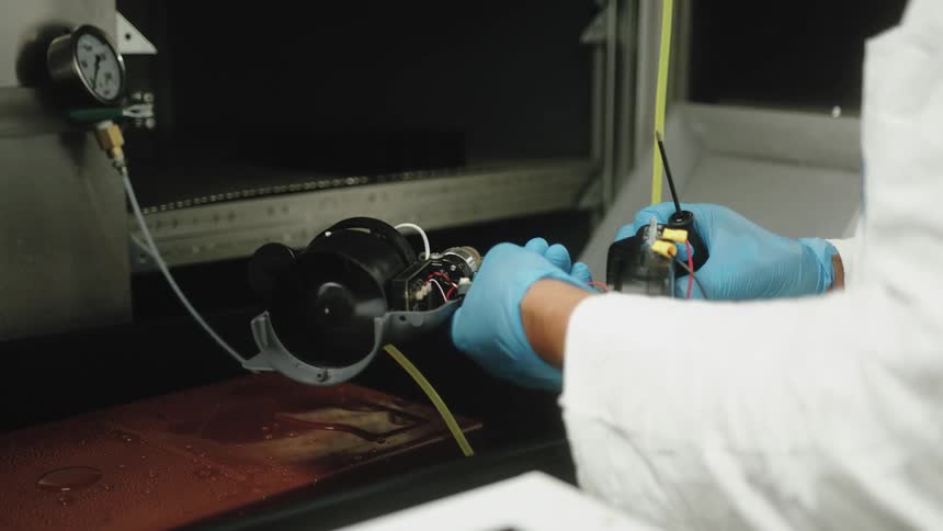 The technician works on a device