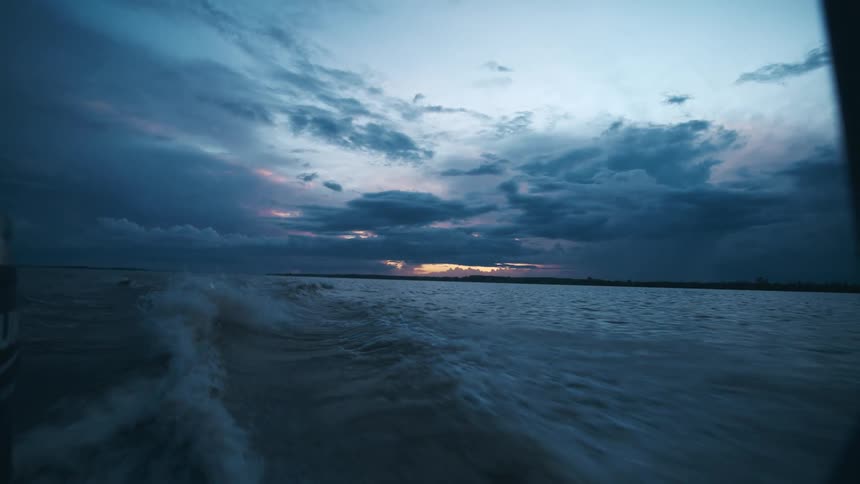 On a boat at sunset