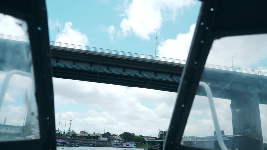 On a boat heading towards a bridge