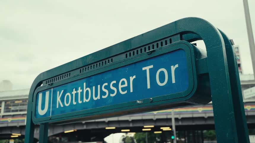 The blue sign of the subway station U Kottbusser Tor is in the city