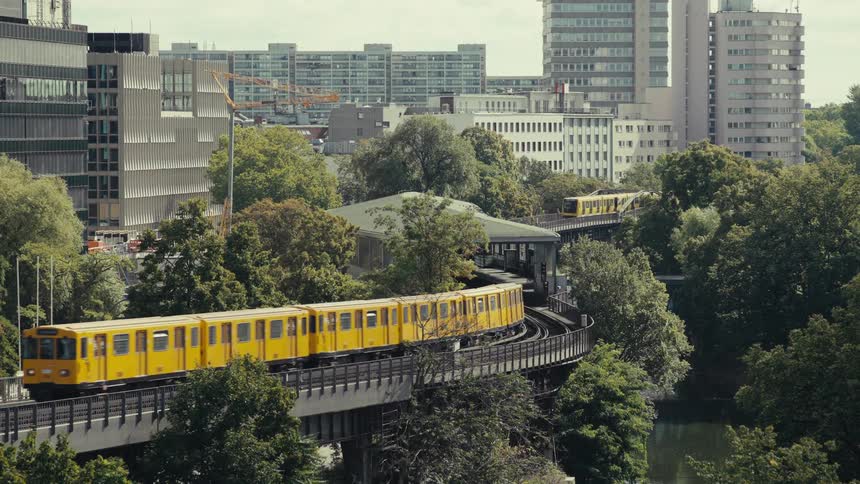 Trains follow tracks around a city