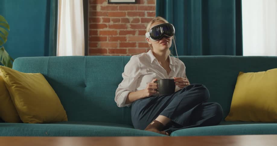 The woman laughs while using a vr headset