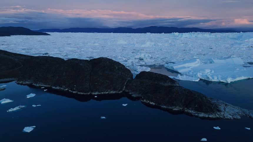 The shore line is covered with sea ice
