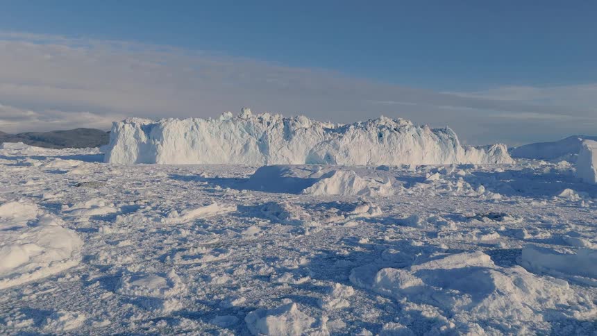 Glaciers and icebergs with melting ice in the arctic